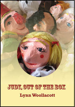 Yellow cover with a picture across top half of Punch and Judy puppets, and a picture of Judy in a circle in the middle. Styllised lettering in red and white: Fairground script